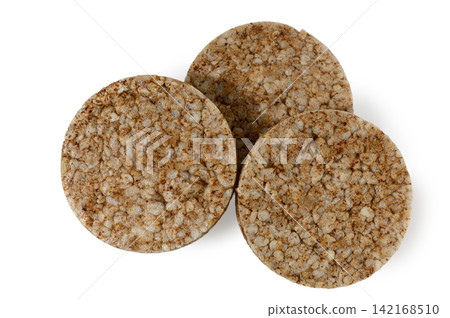 Three round whole grain rice cakes on a white background Three round whole grain rice cakes on a white background 142168510