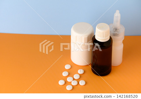 Exploring various medications and supplements arranged on a vibrant orange surface Exploring various medications and supplements arranged on a vibrant orange surface 142168520
