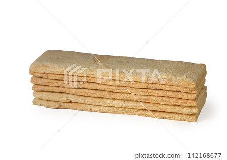 Stack of rectangular crispy wheat crispbread sticks on a white background Stack of rectangular crispy wheat crispbread sticks on a white background 142168677