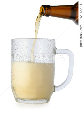 Pouring beer from a brown bottle into a condensation-covered glass mug with rising foam on a white background Pouring beer from a brown bottle into a condensation-covered glass mug with rising foam on a white background 142168681