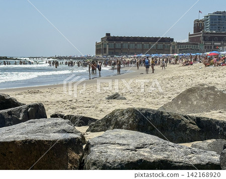 Visitors Enjoy the Beach at Asbury Park in New Jersey on a Sunny Day Visitors Enjoy the Beach at Asbury Park in New Jersey on a Sunny Day 142168920