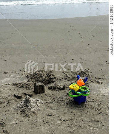 Children Play Sand Toys on a Beach Children Play Sand Toys on a Beach 142168993