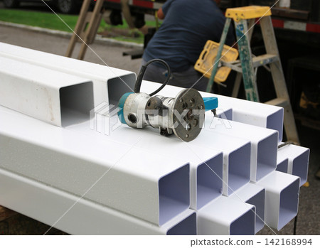 Construction Site With PVC Fence Posts and Tools for a Project Construction Site With PVC Fence Posts and Tools for a Project 142168994