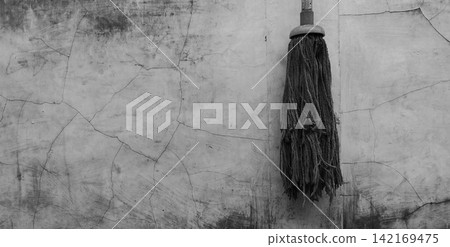 Black and white mop texture on cracked concrete wall Black and white mop texture on cracked concrete wall 142169475