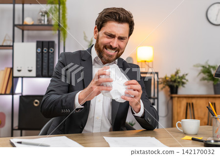 Middle-aged businessman manager crushes faulty report exhales hard calms and returns to edit again Middle-aged businessman manager crushes faulty report exhales hard calms and returns to edit again 142170032