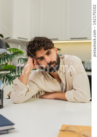 Indian man tired stressed feeling burnout low motivation emotional fatigue at work after long hours Indian man tired stressed feeling burnout low motivation emotional fatigue at work after long hours 142170102