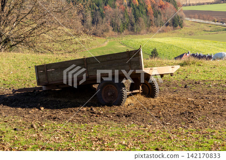 Farmer wagon on an agricultural field in the Gurktal Alps, Carinthia, Austria. Farmer wagon on an agricultural field in the Gurktal Alps, Carinthia, Austria. 142170833