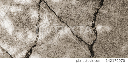 Cracked concrete surface with sepia tones 142170970