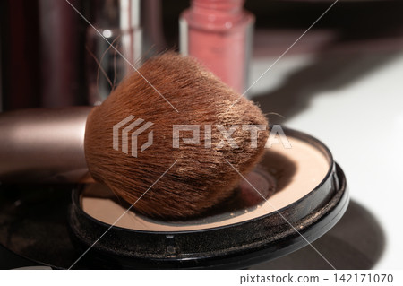 Used makeup brush on nearly empty compact demonstrates wear, hygiene cues, and replacement timing Used makeup brush on nearly empty compact demonstrates wear, hygiene cues, and replacement timing 142171070