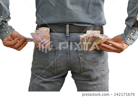Money tucked into denim pockets from rear view, Money tucked into denim pockets from rear view, 142171670