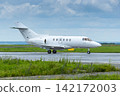 White private jet taxiing an airport taxiway 142172003