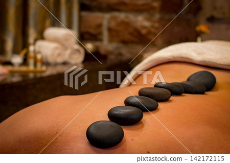 massage of a woman in spa salon massage of a woman in spa salon 142172115