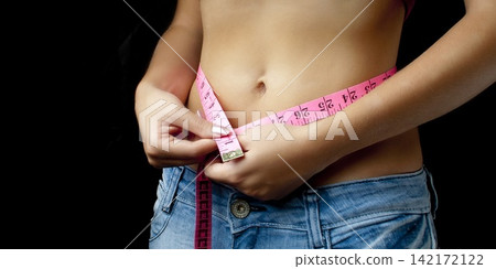woman with measuring tape woman with measuring tape 142172122