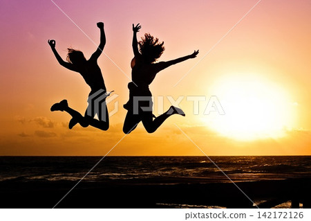 happy jumping on the beach happy jumping on the beach 142172126