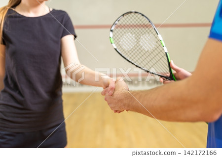 Squash players shaking hands before the match Squash players shaking hands before the match 142172166