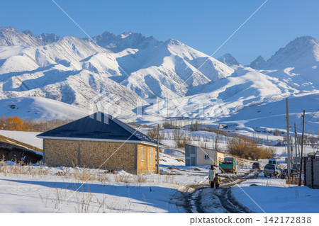 Rural Kyrgyz Village in Snowy Mountains Rural Kyrgyz Village in Snowy Mountains 142172838