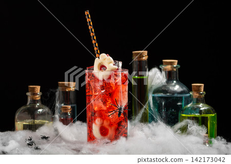 Spooky Halloween Cocktail With Potion Bottles And Cobwebs For Themed Party And Celebration Spooky Halloween Cocktail With Potion Bottles And Cobwebs For Themed Party And Celebration 142173042