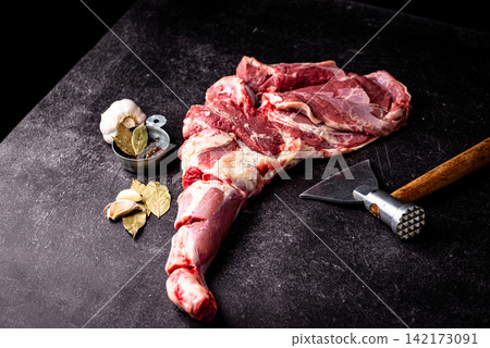 Raw leg of lamb, ready to cook Raw leg of lamb, ready to cook 142173091