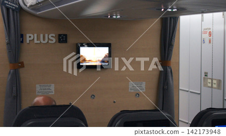 Stockholm, Sweden, December 10 2015: Premium economy cabin interior after boarding on long haul flight Stockholm, Sweden, December 10 2015: Premium economy cabin interior after boarding on long haul flight 142173948