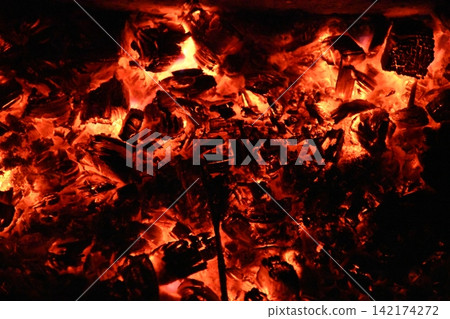 Fire embers particles over black background. Fire sparks background. Abstract dark glitter fire particles Fire embers particles over black background. Fire sparks background. Abstract dark glitter fire particles 142174272