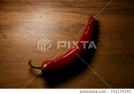 red chili peppers - spicy food ingredient background red chili peppers - spicy food ingredient background 142174295