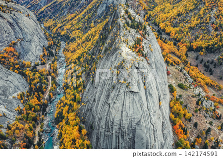 Aerial Autumn Mountain Valley with Granite Cliffs and Turquoise River Aerial Autumn Mountain Valley with Granite Cliffs and Turquoise River 142174591