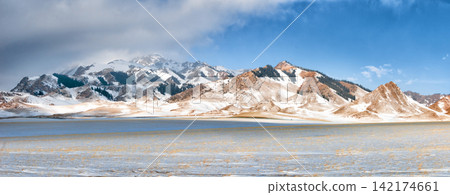 Snowy Mountain Panorama Under Blue Winter Sky Snowy Mountain Panorama Under Blue Winter Sky 142174661