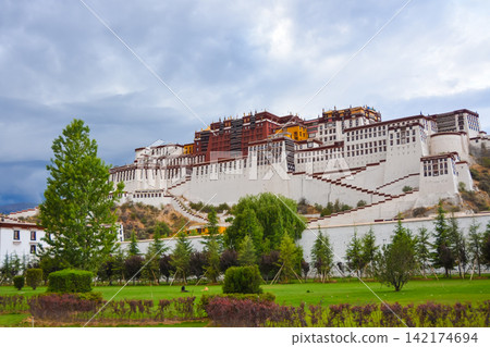 Potala Palace in Lhasa Tibet with Dramatic Cloudy Sky Potala Palace in Lhasa Tibet with Dramatic Cloudy Sky 142174694