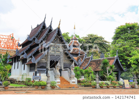 Thai Lanna Temple with Ornate Wooden Roof in Chiang Mai Thai Lanna Temple with Ornate Wooden Roof in Chiang Mai 142174741