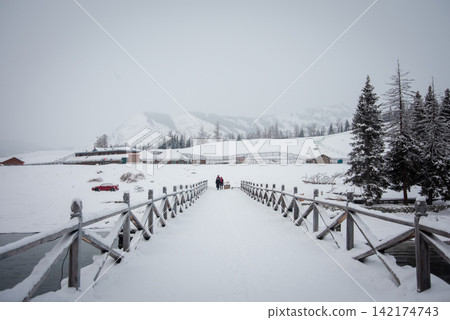 Winter Snow Bridge in Misty Mountain Landscape Winter Snow Bridge in Misty Mountain Landscape 142174743