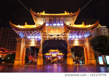 Illuminated Chinese Traditional Archway at Night in Urban Plaza Illuminated Chinese Traditional Archway at Night in Urban Plaza 142174776