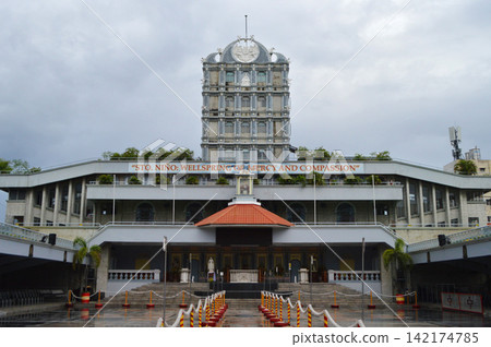 Catholic Church Facade Under Cloudy Sky in Cebu Plaza Catholic Church Facade Under Cloudy Sky in Cebu Plaza 142174785