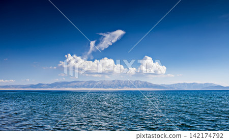 Blue Lake Panorama with Mountains, Clouds, and Clear Sky Blue Lake Panorama with Mountains, Clouds, and Clear Sky 142174792