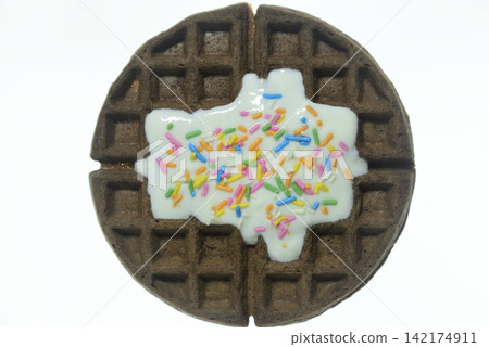 Waffles topped with yogurt and colorful sprinkles - close-up and overhead view Waffles topped with yogurt and colorful sprinkles - close-up and overhead view 142174911