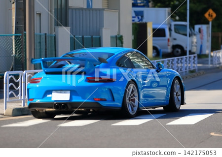 A blue German-made sports car A blue German-made sports car 142175053