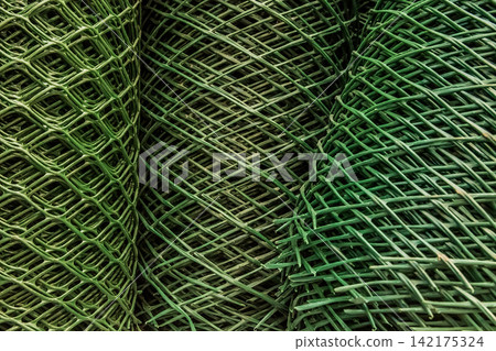 Green plastic mesh roll close up garden used protection fencing object material 142175324