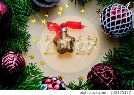 Yellow New Year's background with the number of the coming year 2027. Yellow New Year's background with the number of the coming year 2027. 142175357