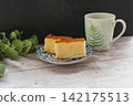 Moist castella cake and a green patterned mug 142175513
