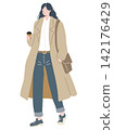 A young woman wearing a trench coat 142176429