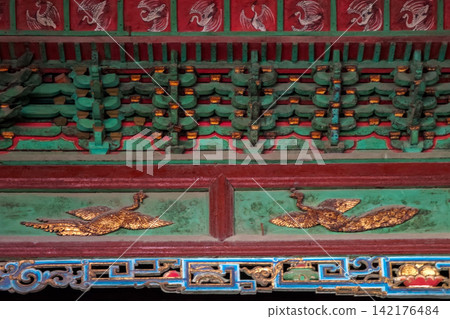 Dougong Brackets and Colorful Painted Ornaments of Sage Mother Hall, Jinci Temple, Taiyuan, Shanxi, China Dougong Brackets and Colorful Painted Ornaments of Sage Mother Hall, Jinci Temple, Taiyuan, Shanxi, China 142176484