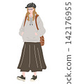 A woman in a casual outfit consisting of a newsboy cap and a hoodie. 142176955