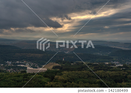 View of the mountains and Kislovodsk from the observation decks of the Kislovodsk Park. Evening sunset over the mountains of Kislovodsk. View of the mountains and Kislovodsk from the observation decks of the Kislovodsk Park. Evening sunset over the mountains of Kislovodsk. 142180499