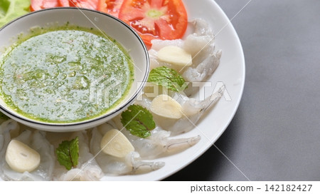 shrimp in fish sauce with Thai spicy seafood dipping sauce on white plate shrimp in fish sauce with Thai spicy seafood dipping sauce on white plate 142182427