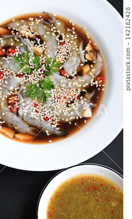 shrimp in soy sauce on white plate, korean style menu shrimp in soy sauce on white plate, korean style menu 142182428