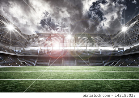 Empty Football Stadium with Cloudy Sky Empty Football Stadium with Cloudy Sky 142183022