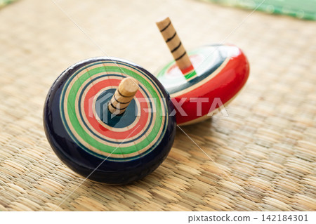 Spinning tops, traditional New Year's games Spinning tops, traditional New Year's games 142184301