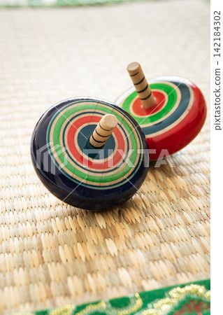 Spinning tops, traditional New Year's games Spinning tops, traditional New Year's games 142184302