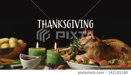 Presenting roasted turkey sitting on platter at table, with lit candles and THANKSGIVING day sign Presenting roasted turkey sitting on platter at table, with lit candles and THANKSGIVING day sign 142185180