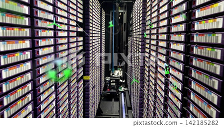 Moving robotic gantry gliding along archive aisle, riding metal rails by purple racks of cartridges Moving robotic gantry gliding along archive aisle, riding metal rails by purple racks of cartridges 142185282