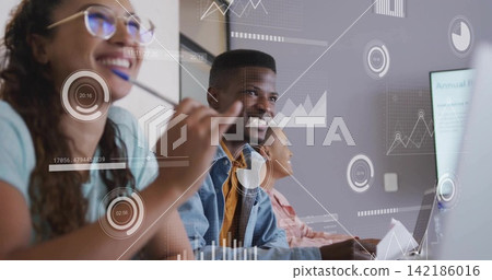 Smiling man in denim jacket and mustard shirt watching slides in meeting room with laptop overlays Smiling man in denim jacket and mustard shirt watching slides in meeting room with laptop overlays 142186016